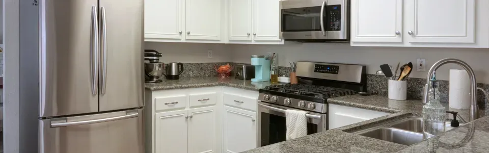 kitchen with marble four-inch backsplash all around above the countertops